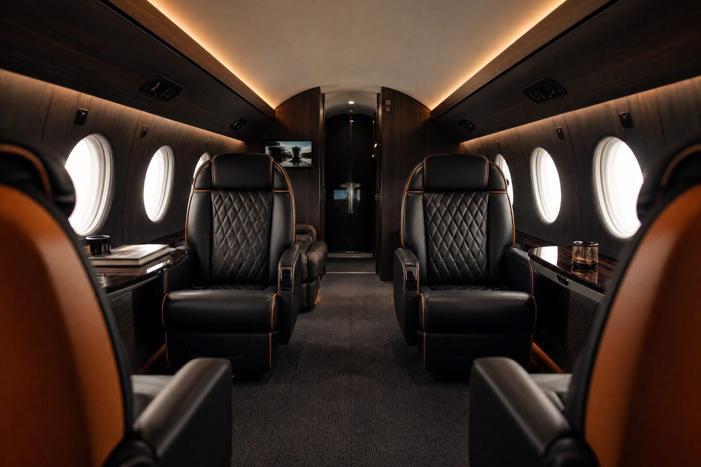 Design visualisation of a cabin interior in black quilted leather with cognac piping and smoked eucalyptus veneer.